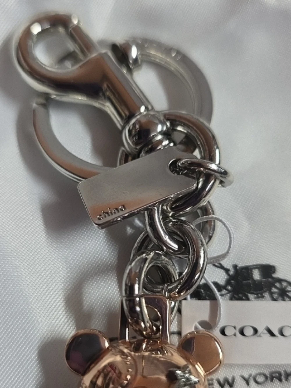 The official Rose Gold Coach 3D Mascot Bear Bag Charm & Keychain
